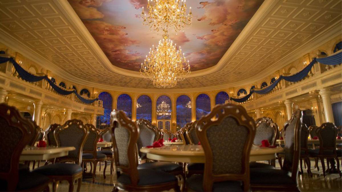Be Our Guest Restaurant table and chairs set up for dinner in Fantasyland at Disney World in Orlando, Florida, USA